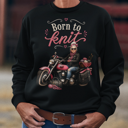 Person wearing a black sweatshirt with a graphic and text, standing in front of a barn.