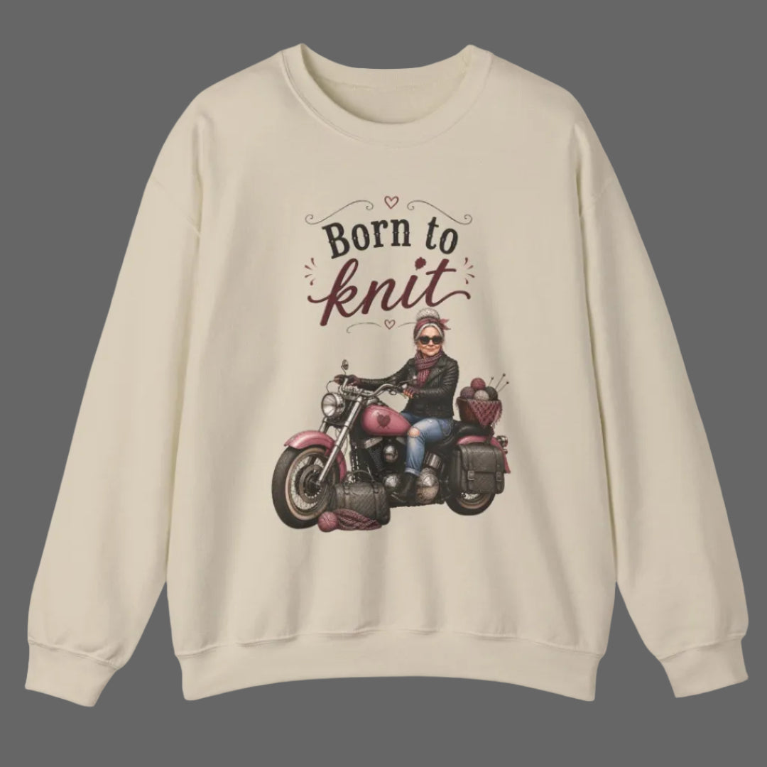 Beige sweatshirt with a graphic of a person on a motorcycle and 'Born to Knit' text.