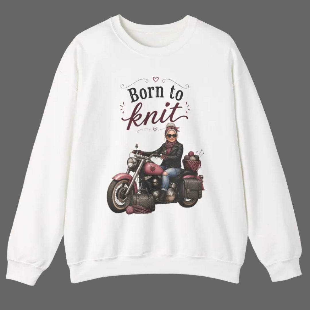 White sweatshirt with a graphic of a person on a motorcycle and 'Born to Knit' text.