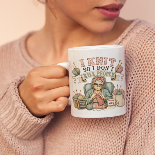 Woman holding a mug with a knitting design and text.
