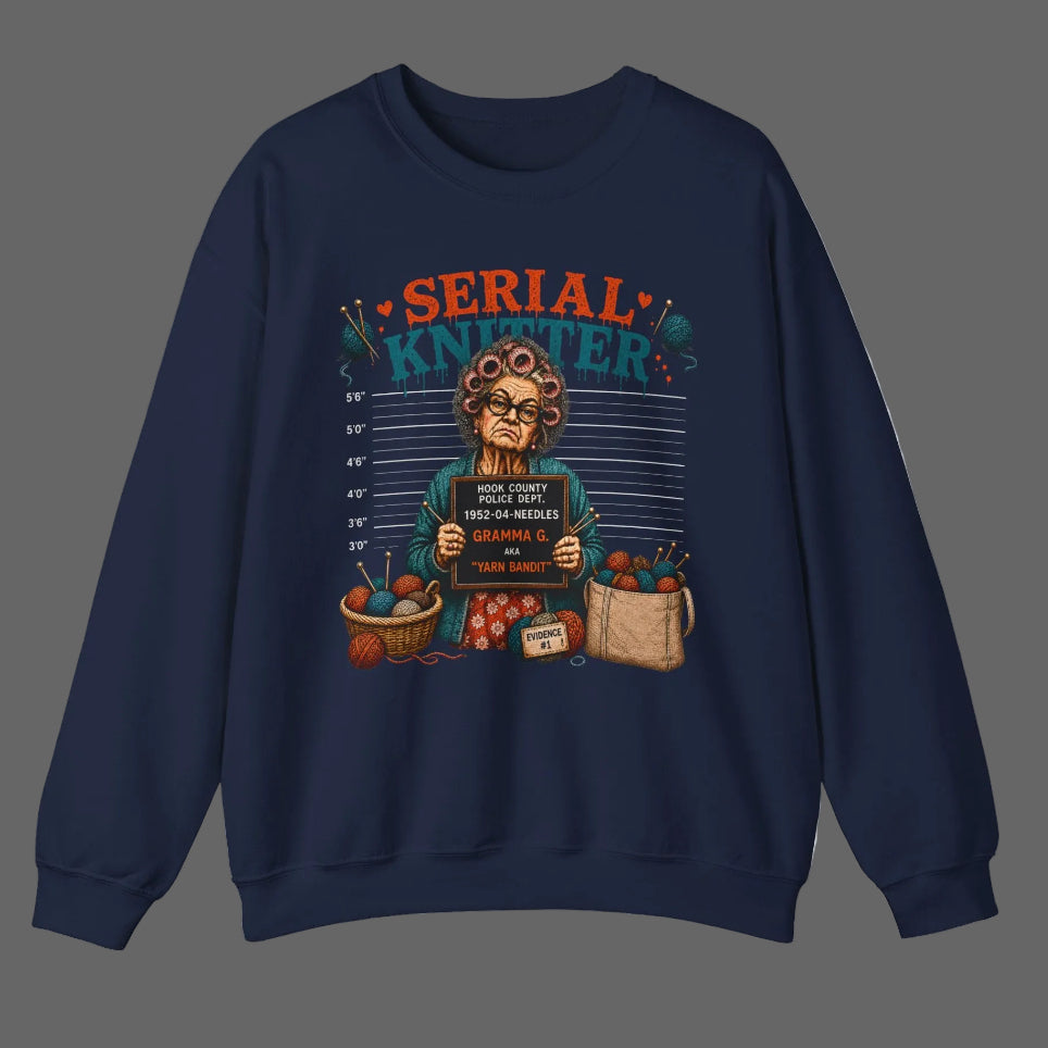 Navy blue sweatshirt with 'Serial Knitter' graphic design on a white background