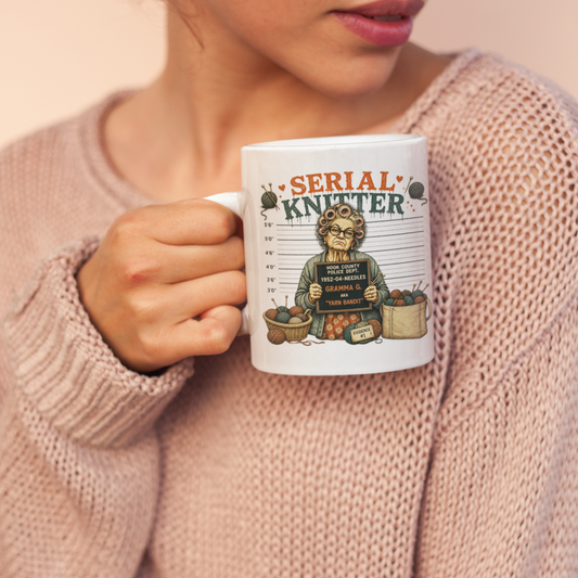 Woman holding a mug with 'Serial Knitter' design against a plain background