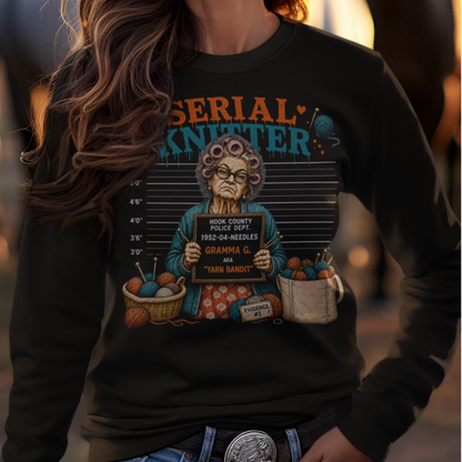 Woman wearing a cowboy hat and graphic t-shirt with horses in the background